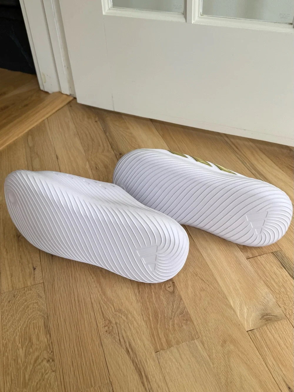 adidas White Slide Sandals with Metallic Gold Stripes